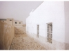 07 - Passage behind classrooms with traditional 'rasaah' stone coursing, Asnab, 2008
